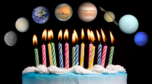 A birthday cake with lit candles. Above it are the eight planets of our Solar System